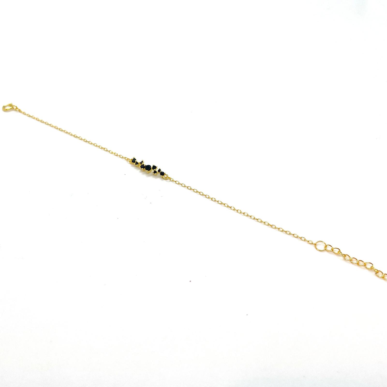 Polsera Constel·lació Daurada – Plata de llei amb bany d’or de 18 kt i circonites negres · 2